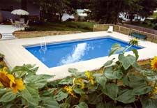 The Canvas:Patchy Midwest farmland, silty soil, hidden treacheriesThe Palette: Tans and taupes, country-style deck, lush landscapingThe Masterpiece: A balanced blend of materials, salt-of-the-earth simplicity, a heartland hideaway