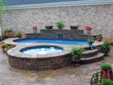 THE CANVAS:Small courtyard, narrow slice of suburbia, Spartan landscapeTHE PALETTE:Bronze antique pavers, Cobalt ceramic tiles, faux pebble fiberglass shellTHE MASTERPIECE: Private retreat, cozy center for spiritual renewal, tranquil sound of moving water
