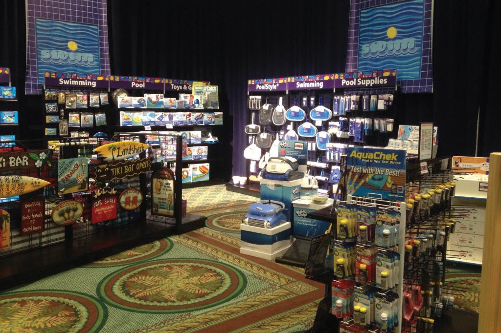 Shelf space: At PoolCorp’s model pool store, the mix of pool and spa products were presented with a clean look, and each product had a QR code attendees could scan to learn more.