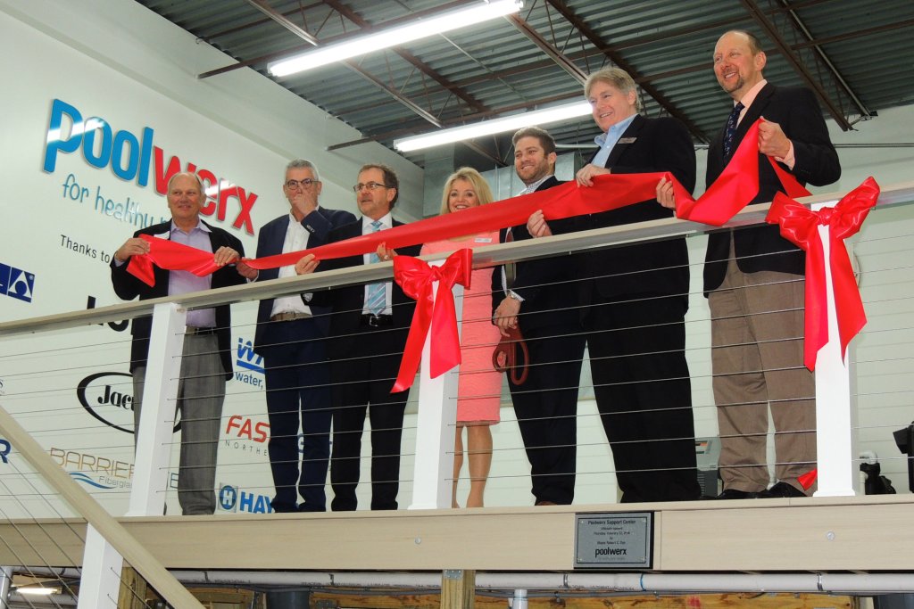 Assembling for the ribbon-cutting ceremony: (l-r) Steve Nimocks of Lonza, Carlos Franquesa of Fluidra; John and Helen O’Brien of Poolwerx; Farmer’s Branch, Texas Mayor Robert Dye; Greg Howard of Carecraft; and Thomas Lachocki, Ph.D. of NSPF.