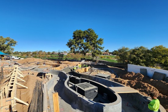 The shotcrete is extended across one of the river’s  loops to strengthen the structure.