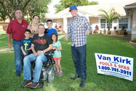 Bobby Van Kirk (left) and Rob Van Winkle (right) pose with the Avilez family.