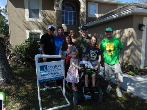 Owen Johnson, center, is next in line to get a pool with the help of Van Kirk & Sons and Rob Van Winkle.