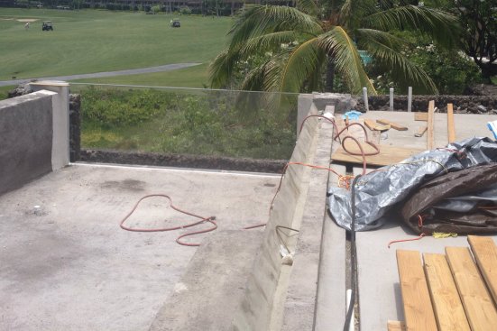 Acrylic expands and contracts more than concrete. Experts generally recommend flexible caulks, grouts and membranes so the panel can move. In the case of vanishing edges, the hydraulic system should probably allow for more water in transit so flows can be adjusted as the wall expands up.