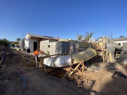 The tube slide being built around the structure.