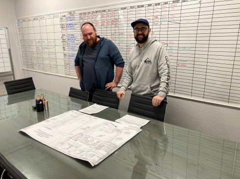 The Green Scene's permit runner, Justin Chavarri, and vice president of construction, Charles Miller.