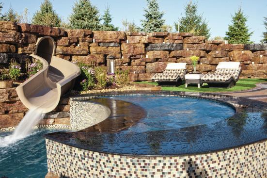 GRAND FINALE: To ensure structual stability for his unique design; Emmerson added more than 20 concrete pillars around the shells. The outside perimeter of the finished pool was framed with black granite and 1-inch glass tile.